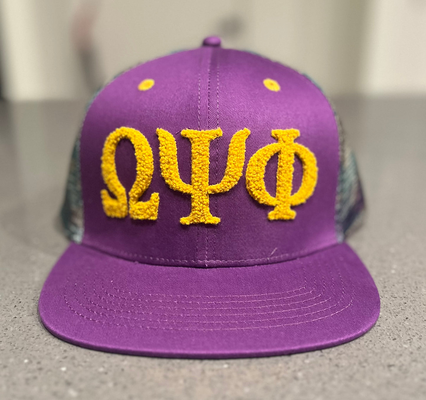 Omega Psi Phi Netback Trucker (Camo Back)